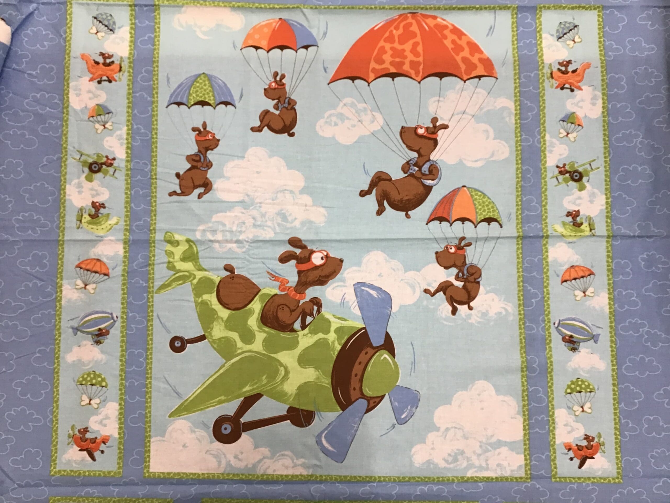 Suzybee SB20001 Flying Dogs on blue clouds 90cm panel Suzybee SB20001 Flying Dogs on blue clouds 90cm panel