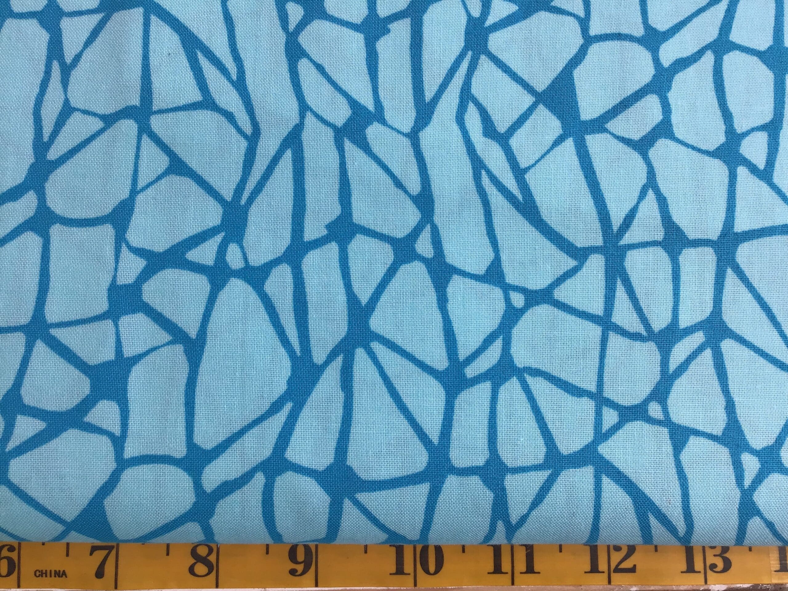 9382T Scales by Kim Schaefer for Andover teal cracked print fabric