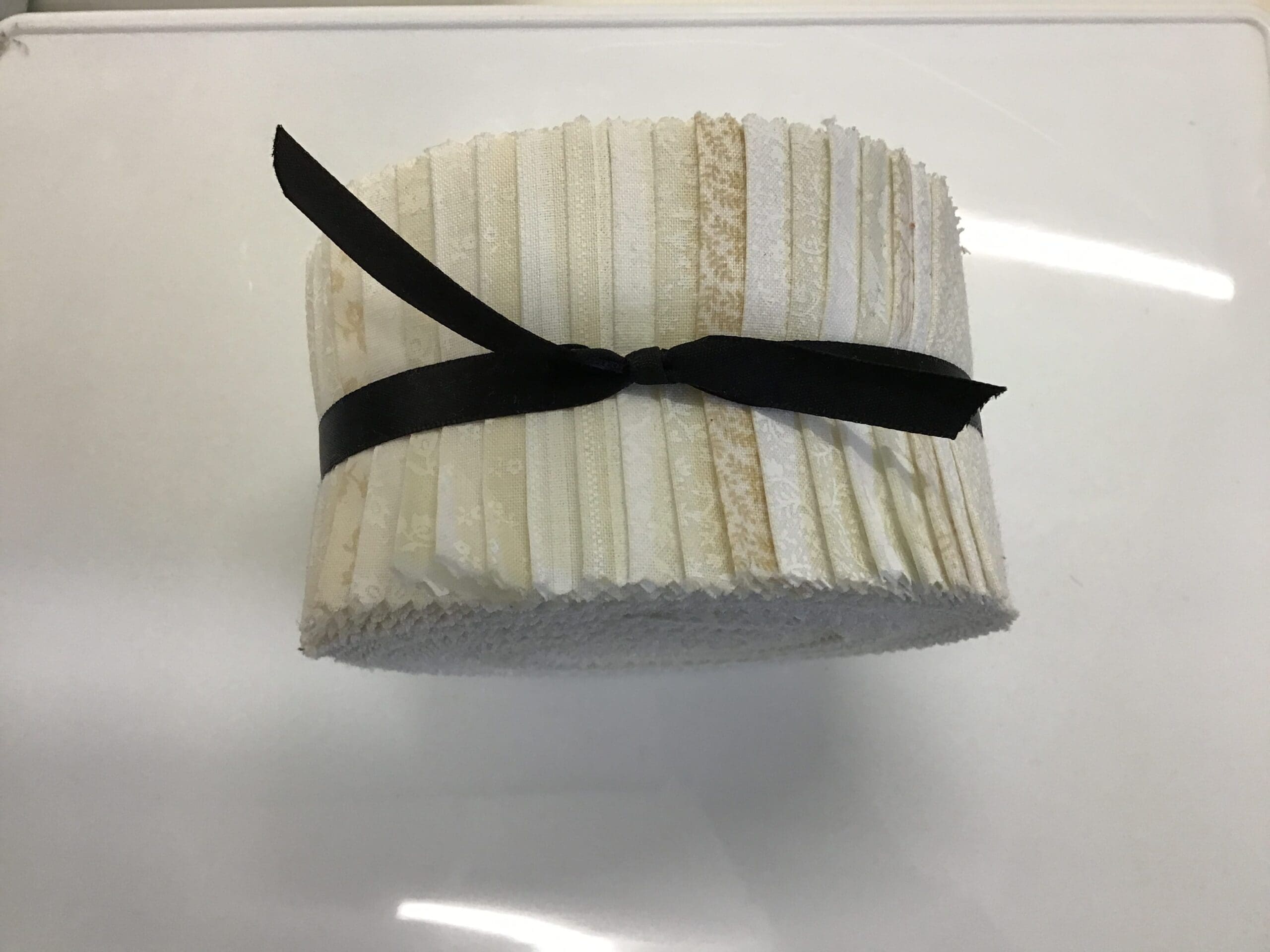 Cream tone on tone strip roll cream jelly roll