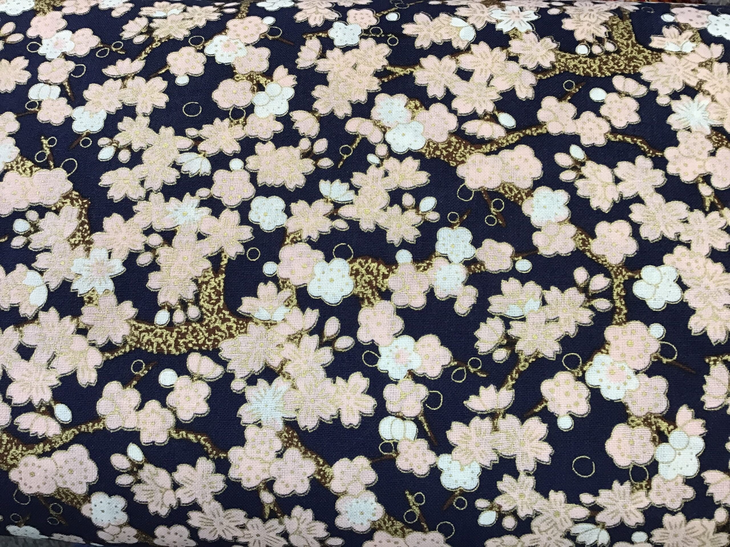 Cherry Blossom PO2642 Pink Gold on navy blue fabric. 54” wide Cherry Blossom PO2642 Pink Gold on navy blue fabric. 54” wide