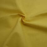 Solid lemon yellow plain fabric by Reynard