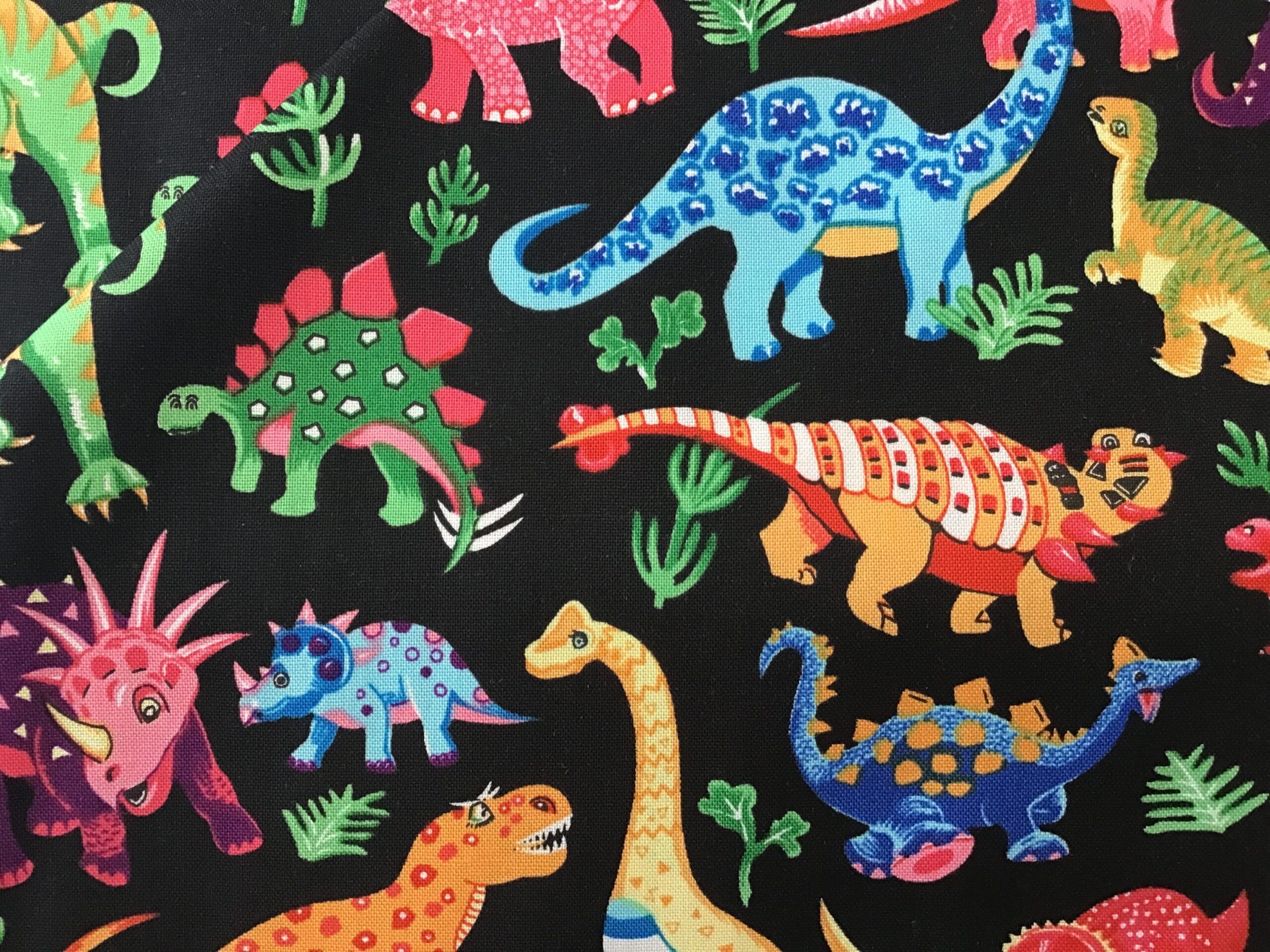 87550, Dinosaur Dance – On Black by Nutex Fabrics 87550, Dinosaur Dance - On Black by Nutex Fabrics