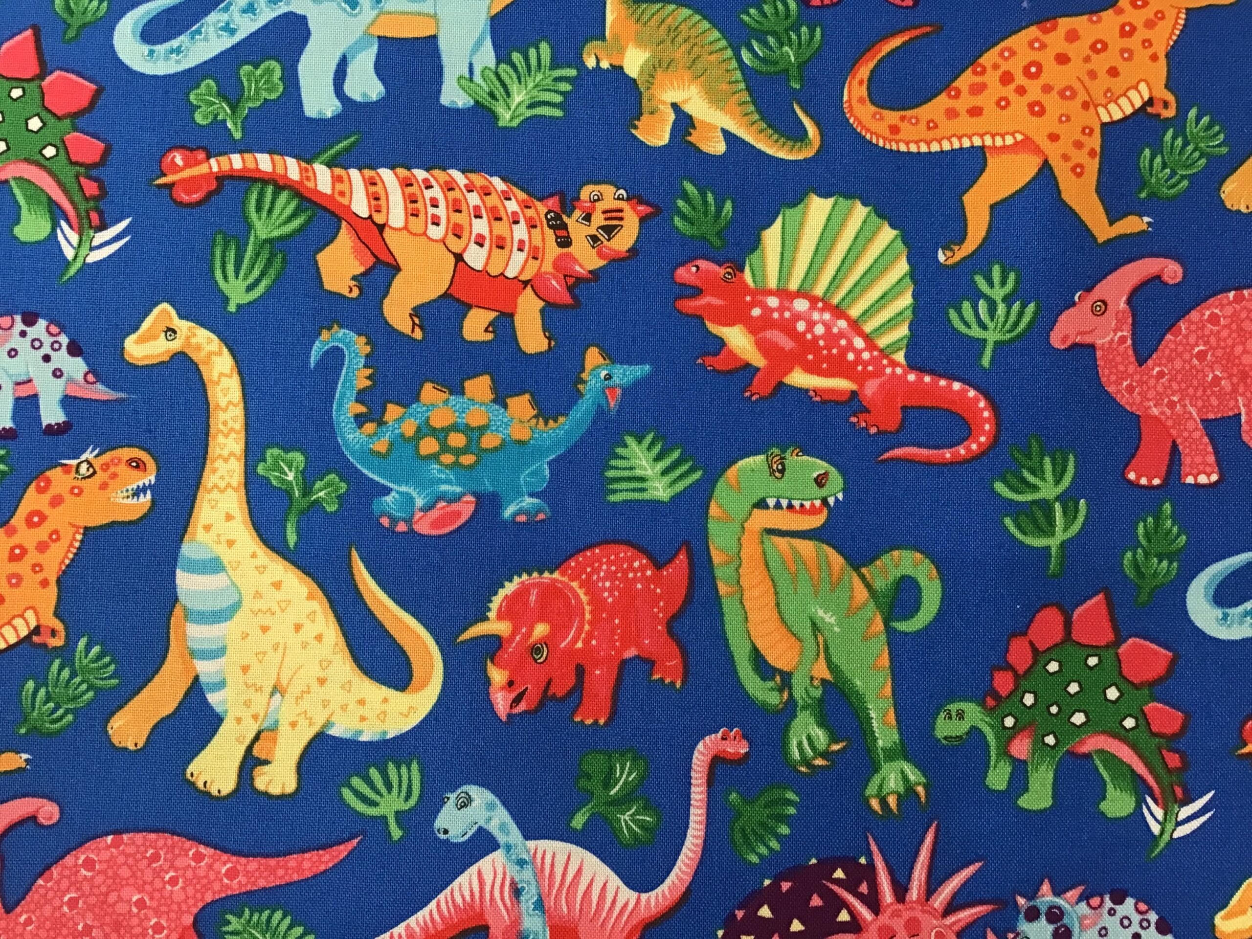 87550, Dinosaur Dance – On Royal Blue, by Nutex Fabrics 87550, Dinosaur Dance - On Royal Blue, by Nutex Fabrics