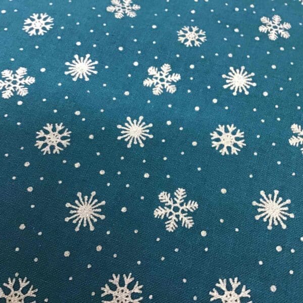 Craft Cotton Christmas print – 126 gold snowflake on dark green background by Reynard Craft Cotton Christmas print - 126 gold snowflake on dark green background by Reynard