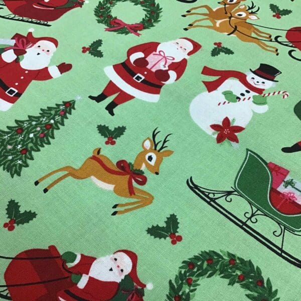 Craft Cotton – Merry and Bright – C8390 Santa on green background by Reynard Craft Cotton - Merry and Bright - C8390 Santa on green background by Reynard