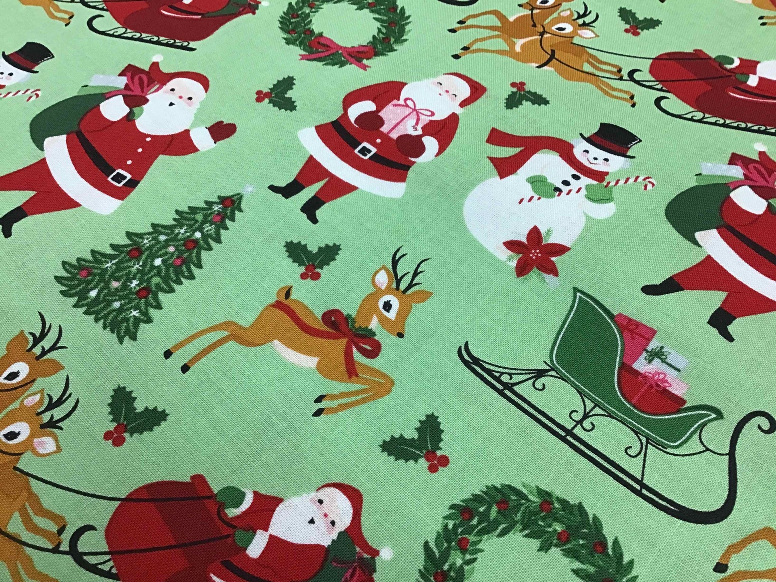Craft Cotton – Merry and Bright – C8390 Santa on green background by Reynard Craft Cotton - Merry and Bright - C8390 Santa on green background by Reynard