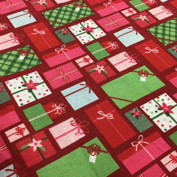 Craft Cotton – Merry and Bright – C8392 Christmas presents on red background by Reynard Craft Cotton - Merry and Bright - C8392 Christmas presents on red background by Reynard