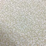 Craft Cotton Christmas print –  312 gold swirls on cream background by Reynard