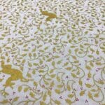 Craft Cotton Christmas print –  337 gold reindeer and swirls on cream background by Reynard