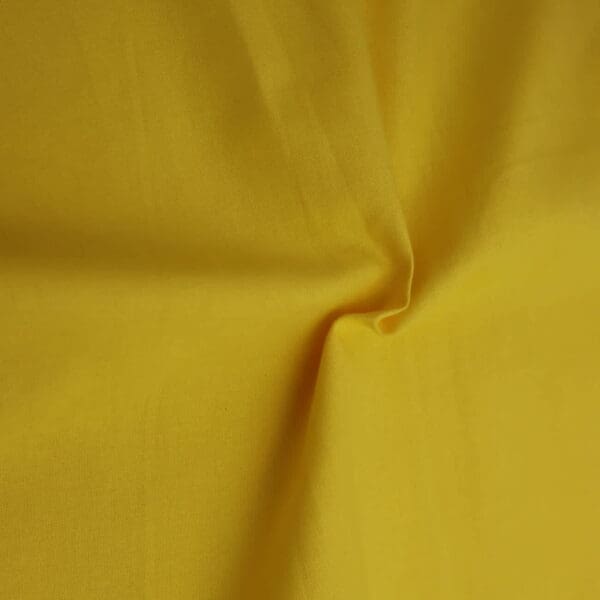 Plain Daffodil Yellow Solid Fabric by Reynard Plain Daffodil Yellow Solid Fabric by Reynard